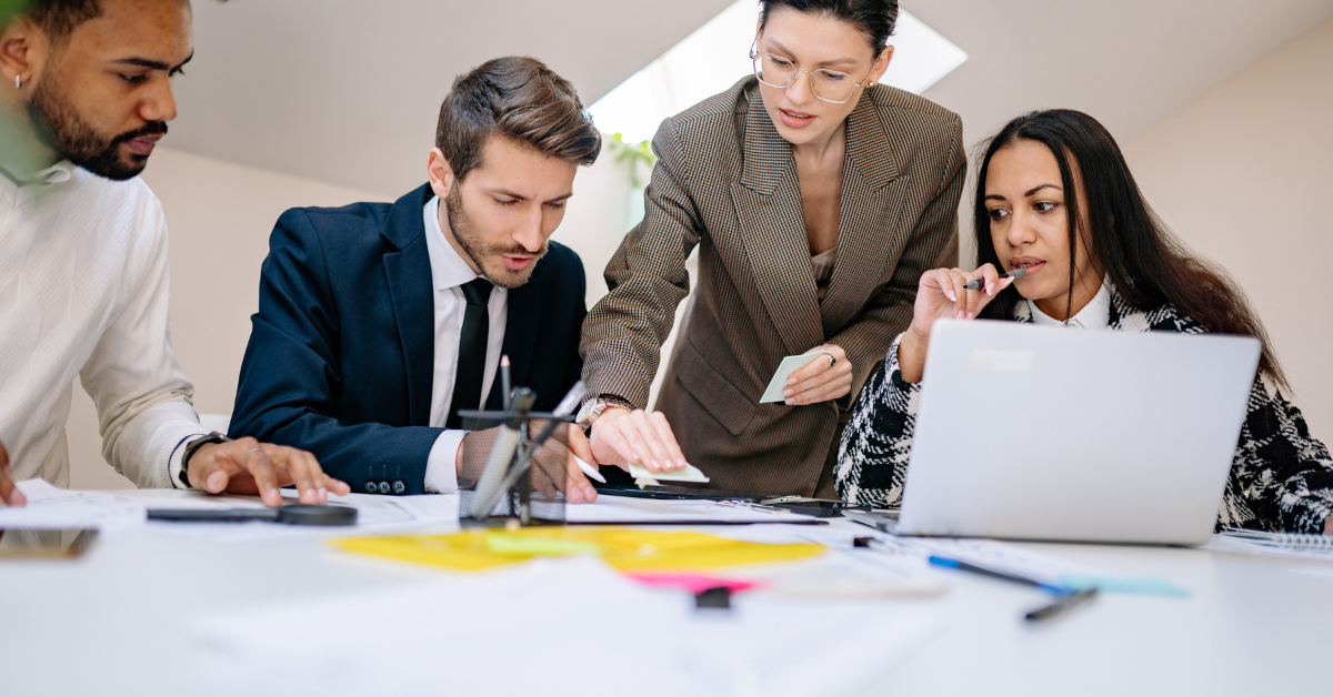 Team of professionals collaborating on business strategy at a modern office table